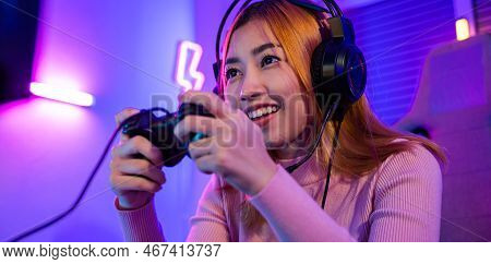 You Win. Gamer Using Joystick Controller Plays Online Video Game With Computer Neon Lights She Winni