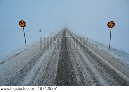 Road Into Mist With Speed Limit At 70