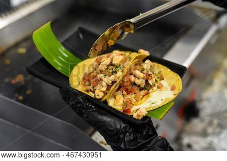 Hands Cooking Tacos In A Mexican Restaurant
