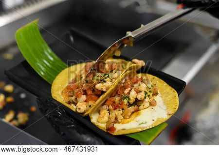 Hands Cooking Tacos In A Mexican Restaurant