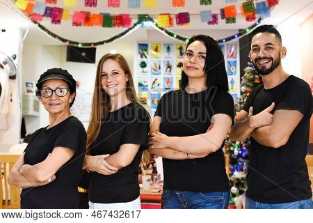 Mexican Team Of People In Mexican Cafe Standing Together