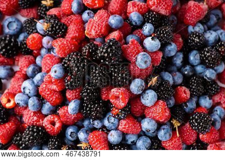 Background From Healthy Fruits. Blueberries, Blackberries And Raspberries. Flat Lay. Vitamins In Nat