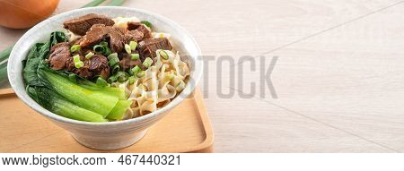 Beef Noodle Soup. Taiwanese Famous Food In A Bowl On Wooden Table.