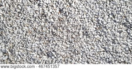 Small White And Gray Or Grey Gravel, Rock Or Stone On The Floor For Background. Hard Material, Art O