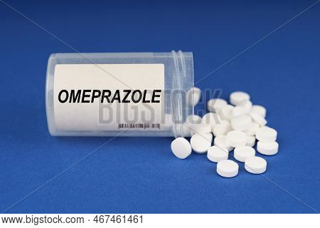 The Concept Of Pharmacology And Health. On A Blue Surface Are Pills And A Dusty Jar With The Inscrip