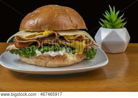 Turkey Meat Between A Brioche Bun  With Mustard Cheese And Mayonnaise