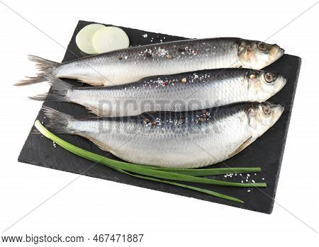 Slate Plate With Salted Herrings, Spices And Onion Isolated On White