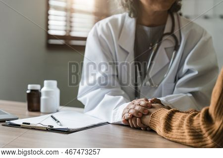 Close Up Doctor Hold Hand Of Patient Give Comfort, Express Health Care Sympathy, Medical Help Trust 