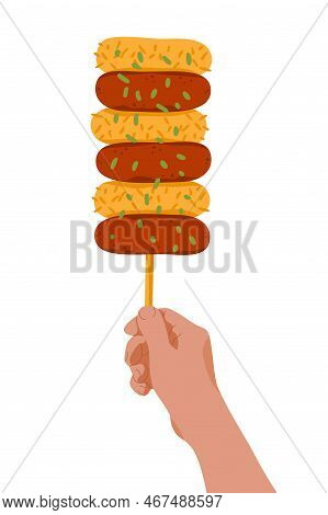 Hand With Rice Cake Skewers On Stick. Korean Street Food Sotteok Sotteok. Fried Sausages Rice Cakes 