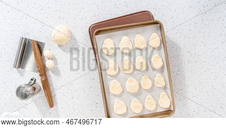 Flat Lay. Rolling Bread Dough With A French Rolling Pin To Bake Naan Dippers.