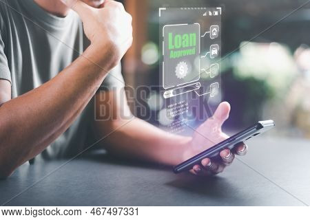 Man Looking At Smartphone,concept Of A Loan For Housing,approval Of Credit For The Purchase Of Real 