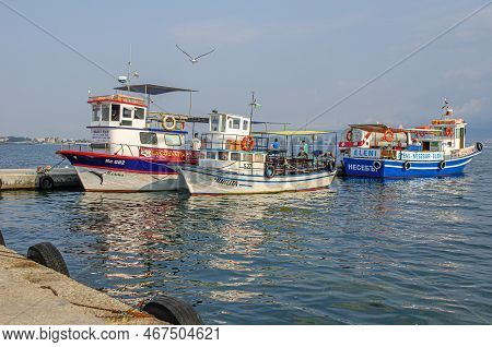 Nessebar, Bulgaria - August 23, 2014: Fishing Boats In The Bay Against The Background Of The Old Tow
