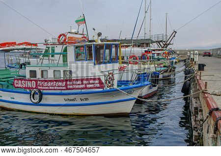 Nessebar, Bulgaria - August 23, 2014: Fishing Boats In The Bay Against The Background Of The Old Tow
