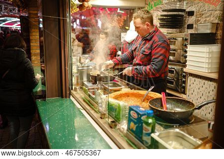 Dusselldorf, Germany - December 13, 2022: Women Preparing Langosh, A Traditional Hungarian Rich Flat