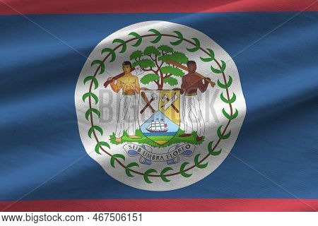 Belize Flag With Big Folds Waving Close Up Under The Studio Light Indoors. The Official Symbols And 