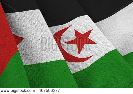 Western Sahara Flag With Big Folds Waving Close Up Under The Studio Light Indoors. The Official Symb