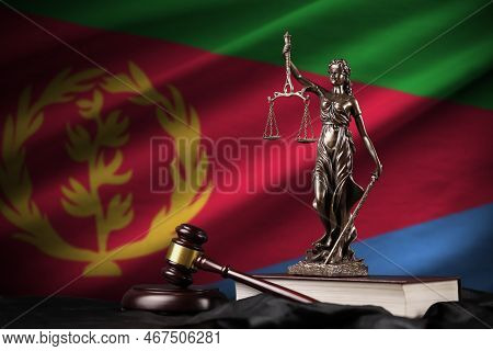 Eritrea Flag With Statue Of Lady Justice, Constitution And Judge Hammer On Black Drapery. Concept Of