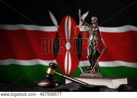 Kenya Flag With Statue Of Lady Justice, Constitution And Judge Hammer On Black Drapery. Concept Of J