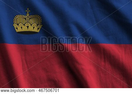Liechtenstein Flag With Big Folds Waving Close Up Under The Studio Light Indoors. The Official Symbo