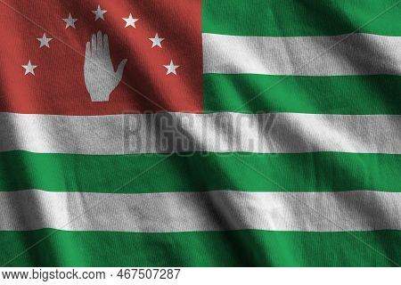 Abkhazia Flag With Big Folds Waving Close Up Under The Studio Light Indoors. The Official Symbols An