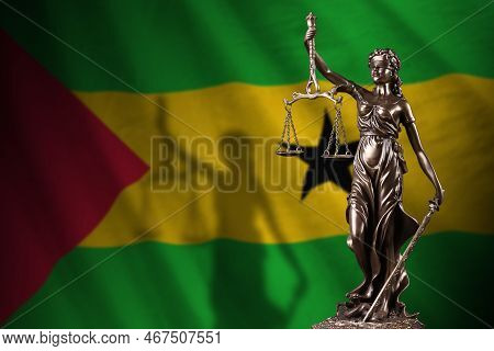 Sao Tome And Principe Flag With Statue Of Lady Justice And Judicial Scales In Dark Room. Concept Of 