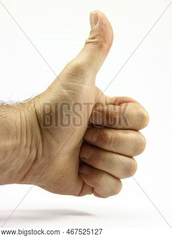 Thumb Up Hand. Male Hand Showing Ok Yes Gesture. Positive Approval Sign. Body Part Isolated On White