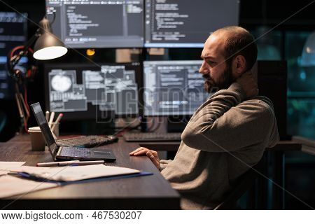 Tense Stressed Engineer Feeling Neck Pressure And Back Pain, Working After Hours At Office. Overwork