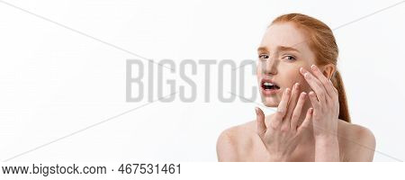 Young Caucsian Woman Squeezes Acne On The Face Of Beauty