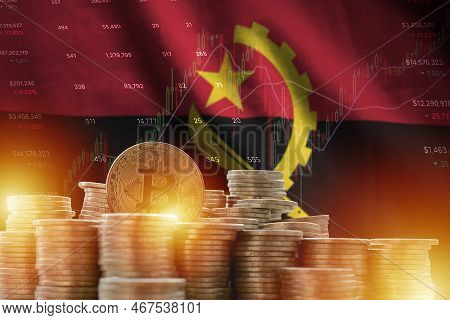 Angola Flag And Big Amount Of Golden Bitcoin Coins And Trading Platform Chart. Crypto Currency Conce