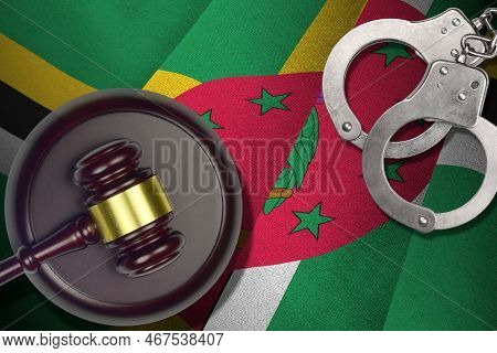 Dominica Flag With Judge Mallet And Handcuffs In Dark Room. Concept Of Criminal And Punishment, Back