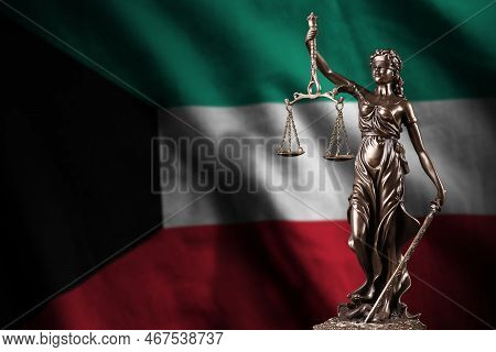 Kuwait Flag With Statue Of Lady Justice And Judicial Scales In Dark Room. Concept Of Judgement And P