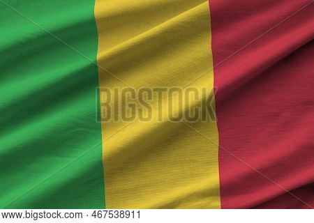 Mali Flag With Big Folds Waving Close Up Under The Studio Light Indoors. The Official Symbols And Co