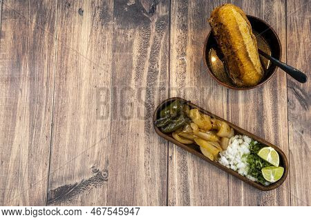 Torta Ahogada Consome Y Birria, Dish With Onion, Sweet Onion And Chile, Wooden Plates Beef Soap
