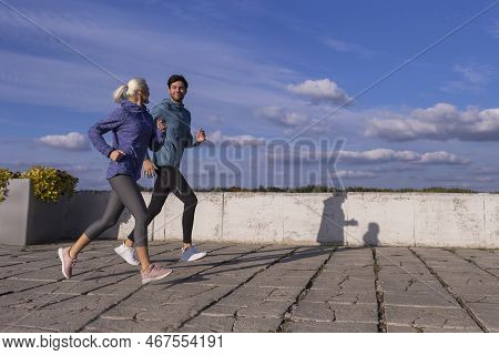 Jogging Concepts. City Running Couple Having Jogging Outside As Runners During Training Outdoor Work