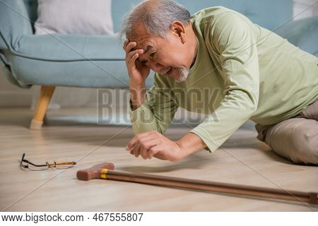Sick Senior Old Man Falling Down Lying On The Ground Because Stumbled At Home Alone With Wooden Walk