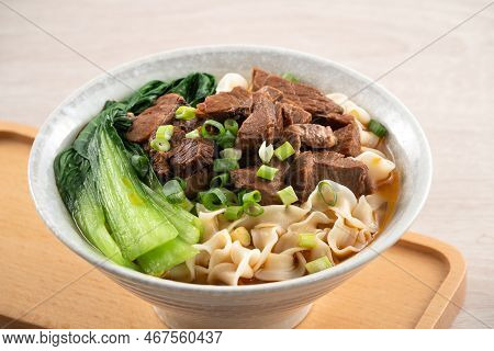 Beef Noodle Soup. Taiwanese Famous Food In A Bowl On Wooden Table.