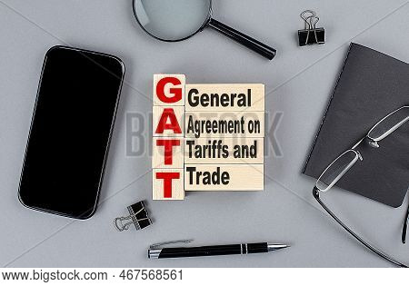 Wooden Cubes Gatt Wtih Notebook , Magnifier And Smartphone, Business
