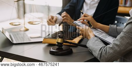 Male Lawyer Working With Contract Papers And Wooden Gavel On Tabel In Courtroom. Justice And Law ,at