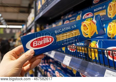 Barilla Pasta. A Customer Takes A Package Of Barilla Pasta From A Supermarket Shelf. The Company Was
