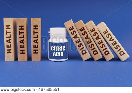 Medical Concept. On A Blue Background, Wooden Plates With The Inscription Health And Disease, In The