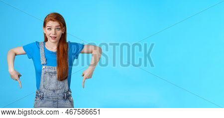 Curious Tender Lovely Ginger Caucasian Girl, Pointing Down Questioned, Check Out Interesting Promo, 