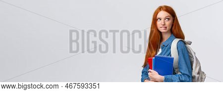 Creative And Thoughtful Cute Daring Foxy Girl With Red Hair, Hold Backpack And Notebooks, Biting Lip