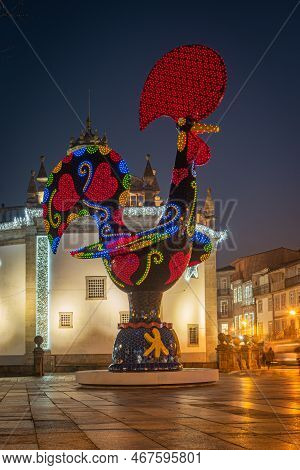 Barcelos, Portugal - Circa Jauary 2019: View At The Pop Galo At Night, Public Art Inspired In The Ba