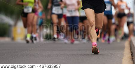 Marathon Runners Running On City Road, Large Group Of Runners
