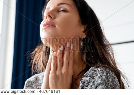 Young Woman Self Examination Thyroid Gland. Hashimoto Or Thyroid Cancer Concept