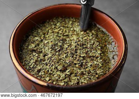 Guampa With Bombilla And Mate Tea On Grey Table, Closeup