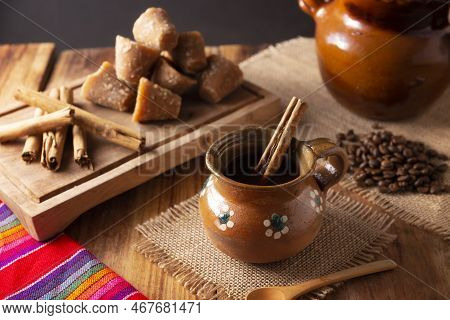 Authentic Homemade Mexican Coffee (cafe De Olla) Served In Traditional Handmade Clay Mug (jarrito De