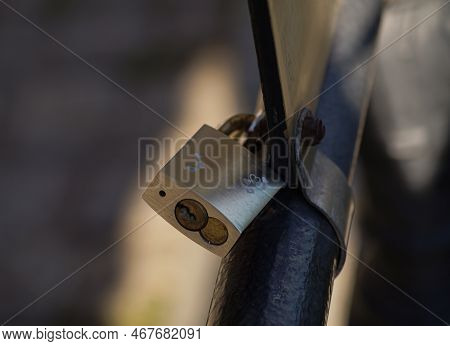 Close Up Of A Lovelock On A Fence