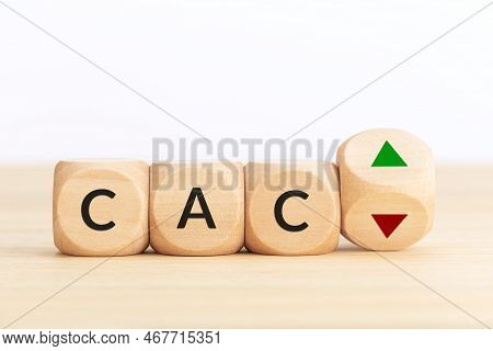 Cac Stock Market Index Prices Up Or Down Concept. Text On Wooden Blocks And Turning Dice With Up And