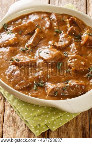 Carbonnade A La Flamande Flemish Beef Stew Closeup On The Pot On The Wooden Table. Vertical